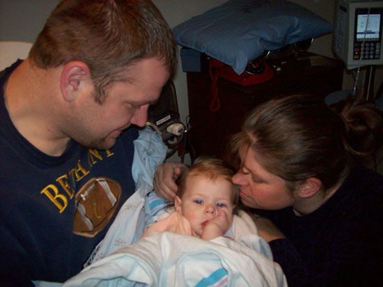 Daddy holds Emily for the first time after her first surgery in December 2007.